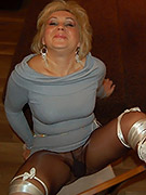 Cheerful wife posing in nylons